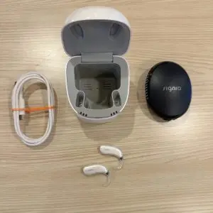 used signia motion 5x bte hearing aids with dry and clean charger, hard carrying case, and charging canle