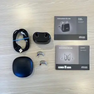 used oticon intent 3 hearing aids with charger, cable, hard carrying case, and original manuals
