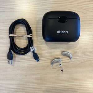 used oticon real 1 hearing aids with premium charger and charging cable